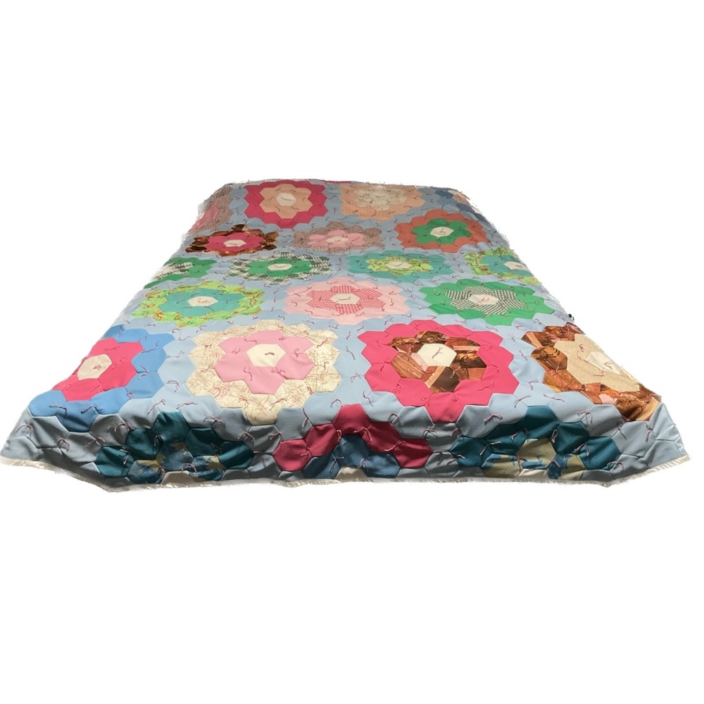 Hand Tied grandma’s flower garden quilt sewn by machine polyester fabric